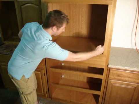 A step-by-step guide on installing a kitchen cabinet. Learn the process of properly setting up a cabinet in your kitchen.