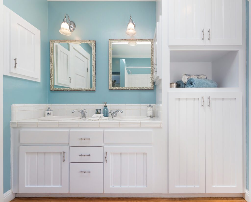 Shot of bathroom with cabinets and blue walls