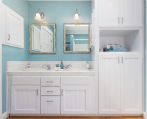 Shot of bathroom with cabinets and blue walls